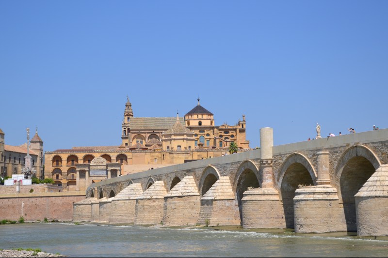 Roman Bridge Cordoba - At the bottom of the picture we can see the Mosque - Cathedral  | Image credit: travelcordoba.com