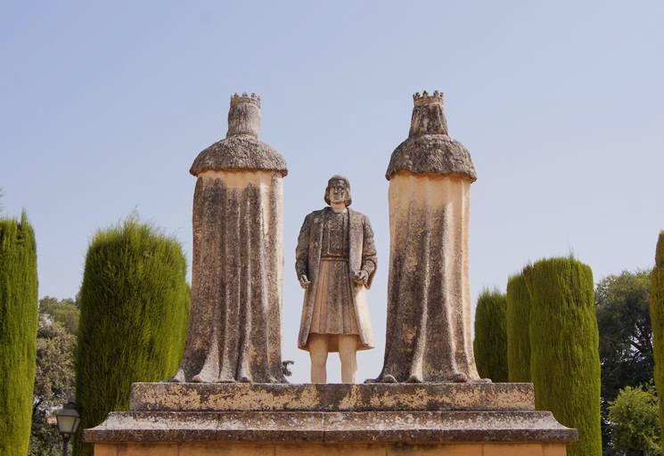 Statue of Christopher Columbus and the Catholic Monarchs in the Alcazar gardens. The statue was designed in the 1970s by Pablo Yusti | Image credit: Jebulon (Wikipedia C.C.)